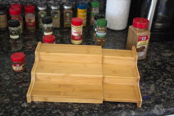 Wooden risers are key to your spice cabinet organization project.